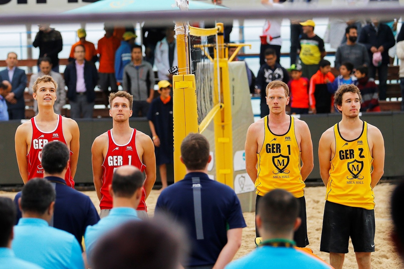Until now, there has always been the net between: Lorenz Schümann (second from the left) with Julius Thole (left) and Markus Böckermann (second from the right) with Lars Flüggen (right). Credit: FIVB.