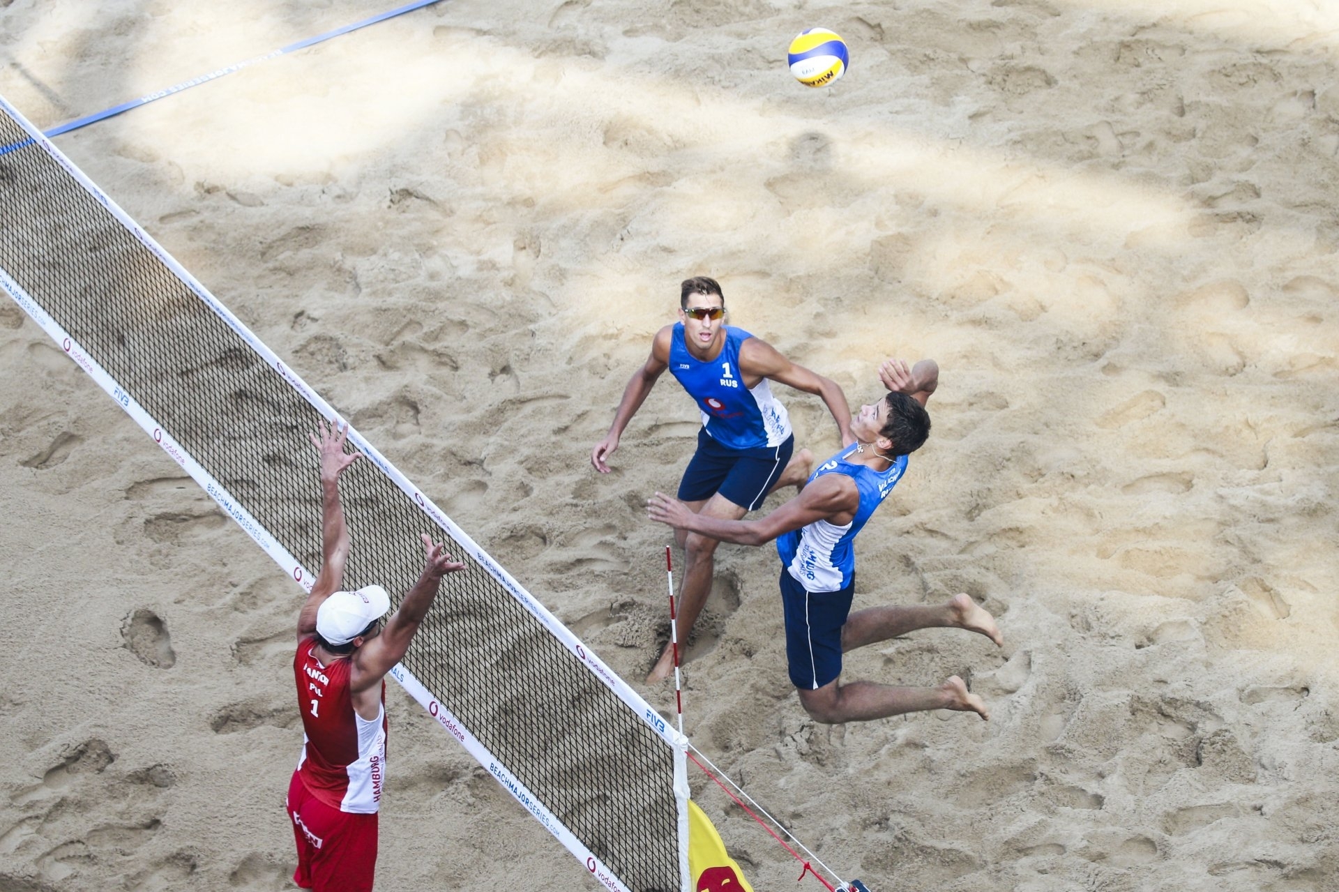 Oleg (left) and Igor (spiking) in action on their World Tour Finals debut